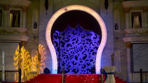 Round shape gate on stage with illumination and architecture adornments photo