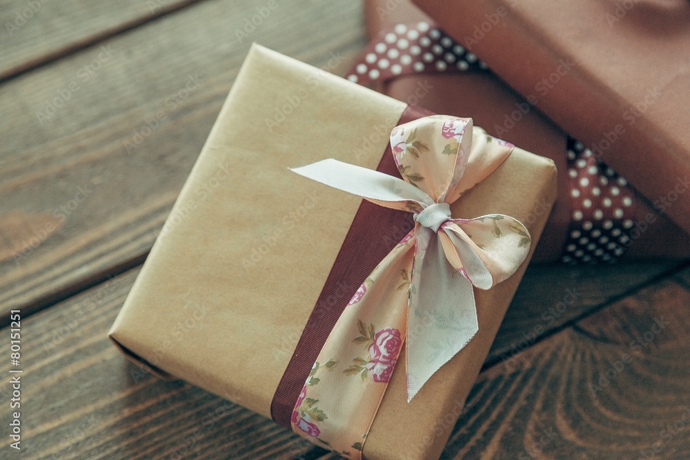 Gift. two elegant gift boxes on a wooden background Gift. two elegant gift boxes on a wooden background