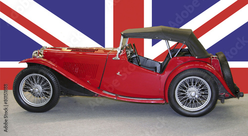 old red britsh car with british flag photo