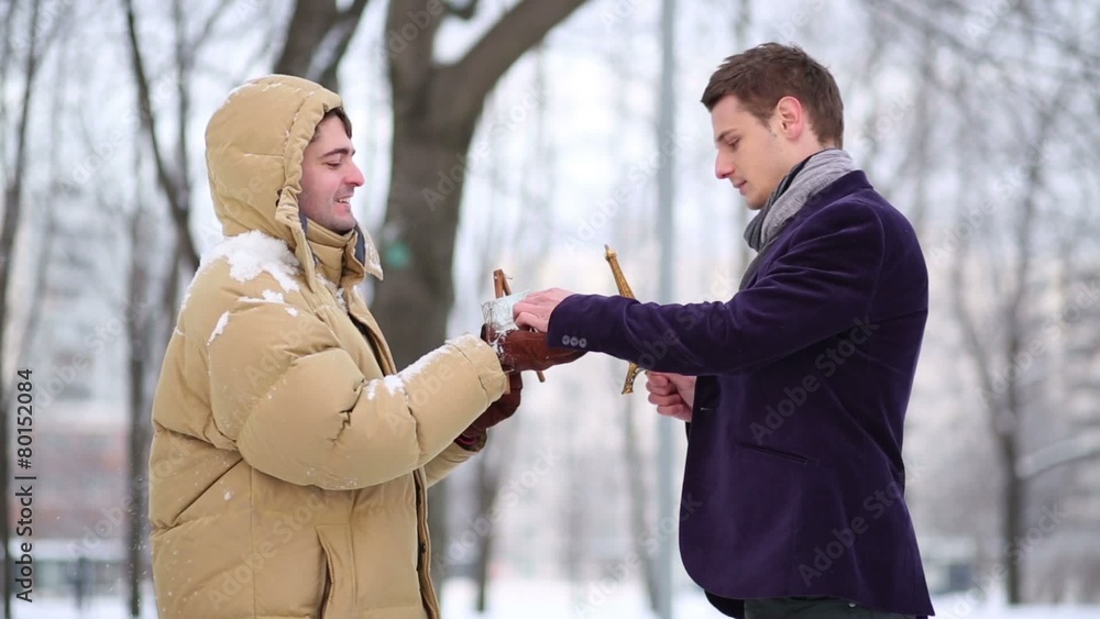 Seller offers person wearing scarf to buy souvenir, drawings Seller offers person wearing scarf to buy souvenir, drawings