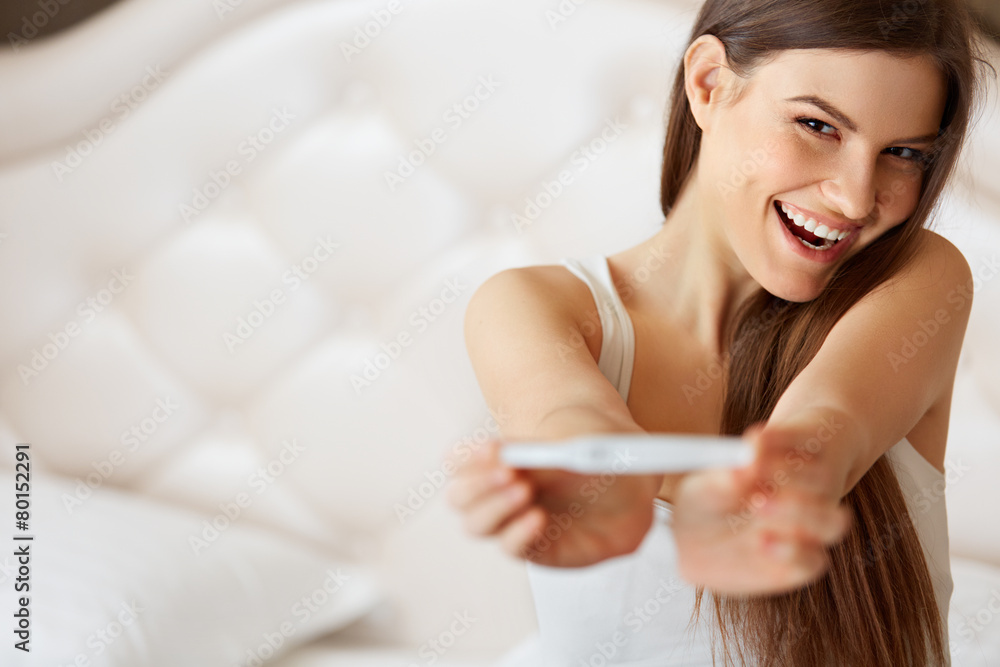 Happy Woman With Pregnancy Test - obrazy, fototapety, plakaty 