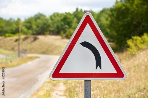 Traffic sign indicating road is turning left