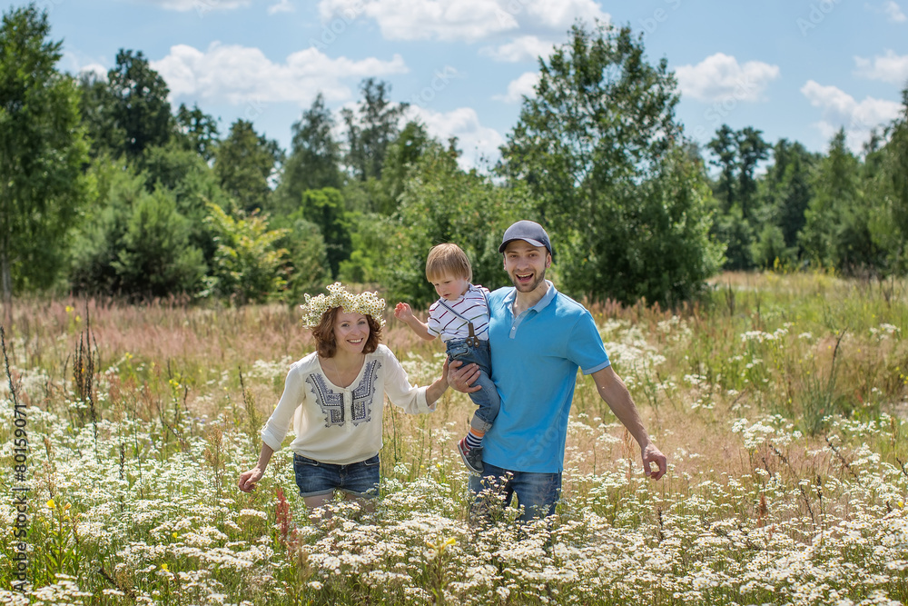 Young Attractive Parents and Child Portrait Outdoors Young Attractive Parents and Child Portrait Outdoors