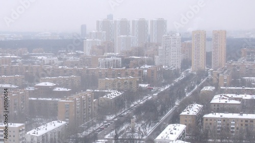 Aerial view of city with zoom in on tower and skyscrapers photo