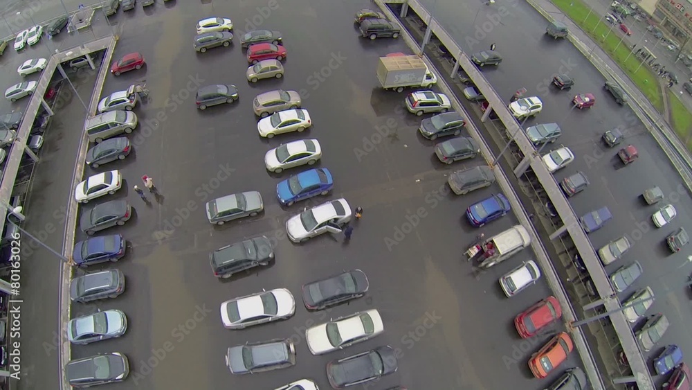 Cars ride by large parking near shopping center Mall Gallery Cars ride by large parking near shopping center Mall Gallery