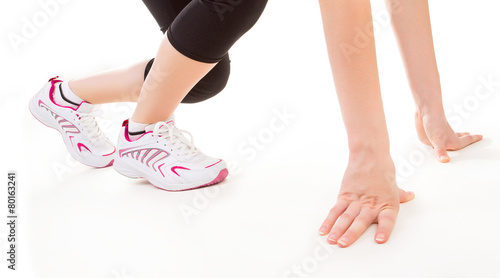 Fitness. Feet of jogging person on white background