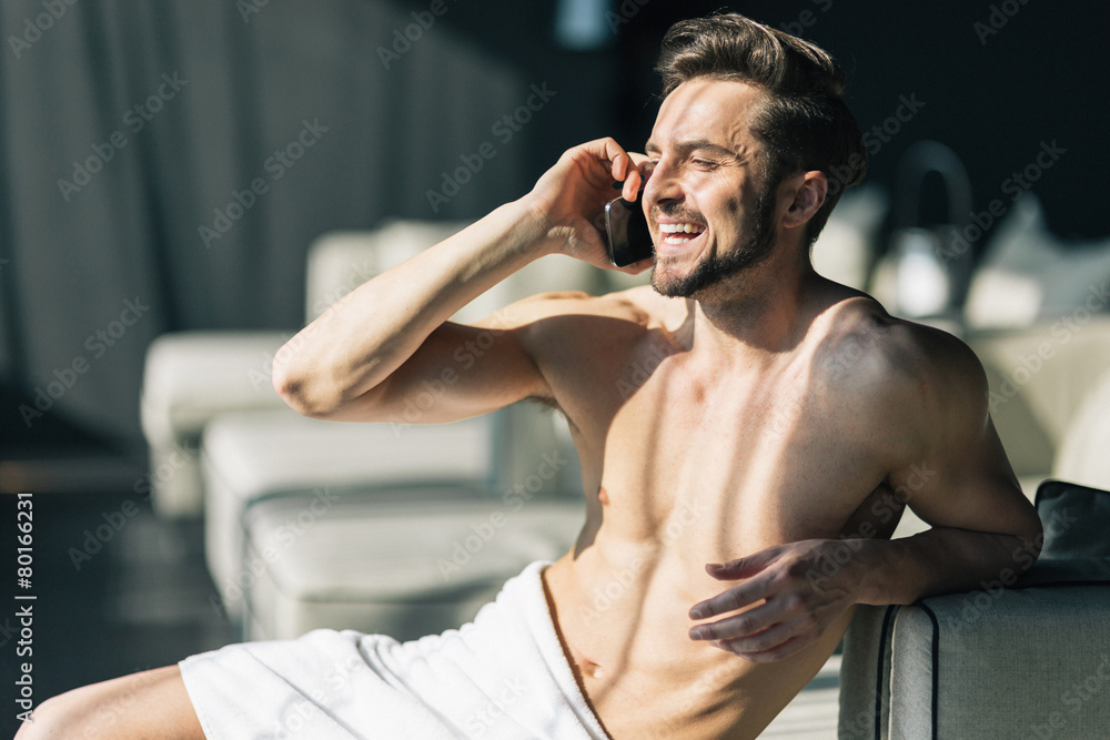 Handsome, young man talking on his cell phone in the morning Handsome, young man talking on his cell phone in the morning