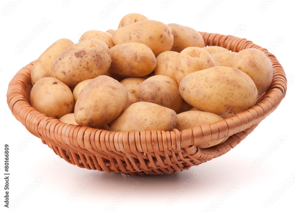 Potato tuber in wicker basket isolated on white background Potato tuber in wicker basket isolated on white background