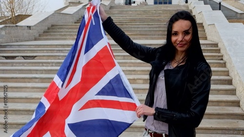 Wallpaper Mural Brunette women with UK Union Jack flag posing smiling outdoors Torontodigital.ca