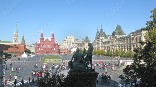 Tourists walk across Red Square in sunny day, time lapse