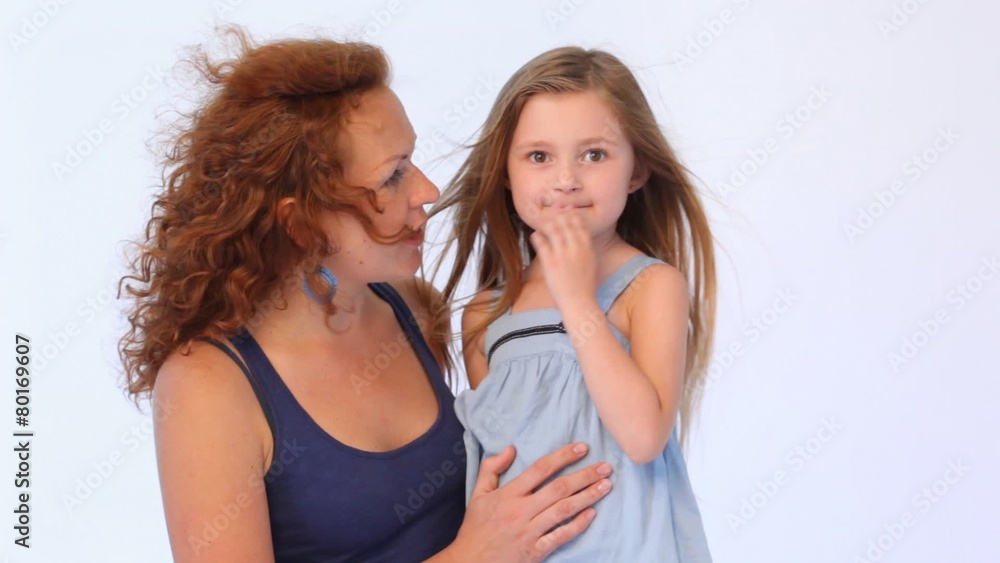 mother embraces daughter and they speak while in them blows wind mother embraces daughter and they speak while in them blows wind