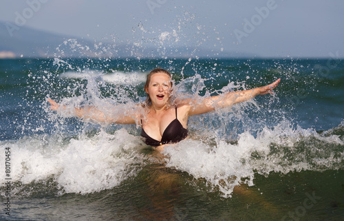 Woman in wave