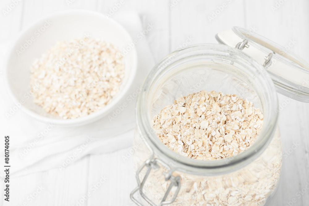 uncooked instant oatmeal in glass jar, shorth depth of field uncooked instant oatmeal in glass jar, shorth depth of field