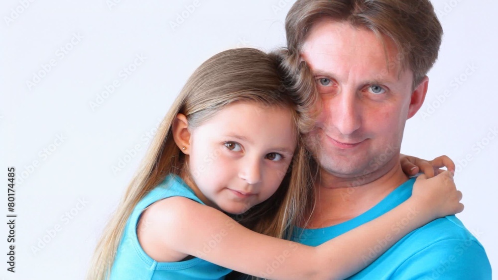 portrait of daughter on hands at father on white close up portrait of daughter on hands at father on white close up