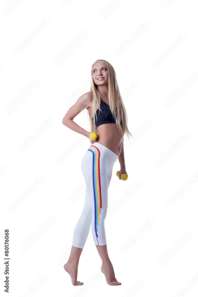 Beautiful sporty girl posing with dumbbells Beautiful sporty girl posing with dumbbells