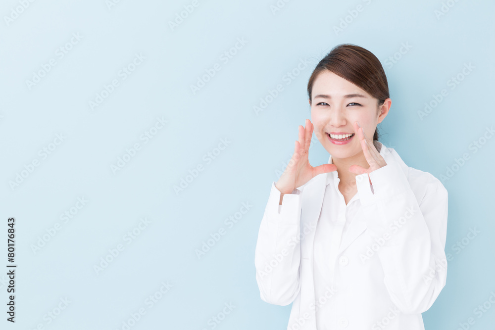 young asian doctor on blue background young asian doctor on blue background