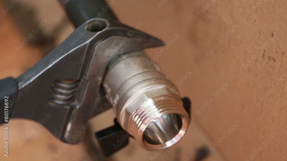 Moving wrench fastens tap for water regulation Moving wrench fastens tap for water regulation