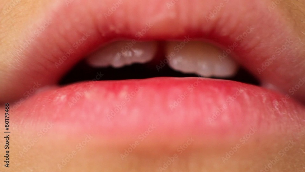 Two incisor teeth in open childish mouth, close-up Two incisor teeth in open childish mouth, close-up