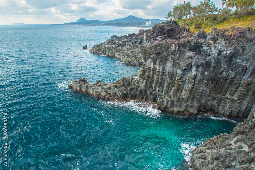 Jungmun Daepo coast with columnar joints at Jeju Island, South K Jungmun Daepo coast with columnar joints at Jeju Island, South K