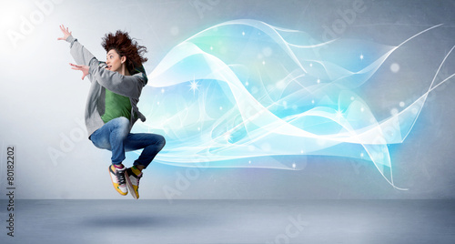 Wallpaper Mural Cute teenager jumping with abstract blue scarf around her Torontodigital.ca