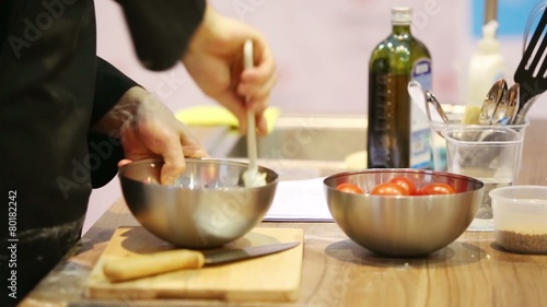 Male hands mixed in bowl mix for making delicious meal photo