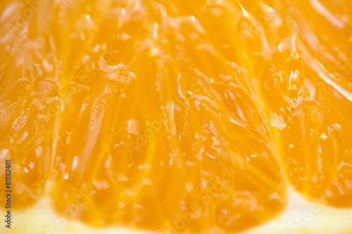 Background of juicy fresh orange. Macro shot