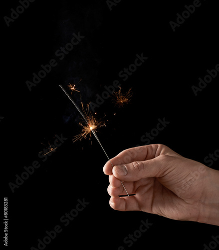 Holding a burning sparkler