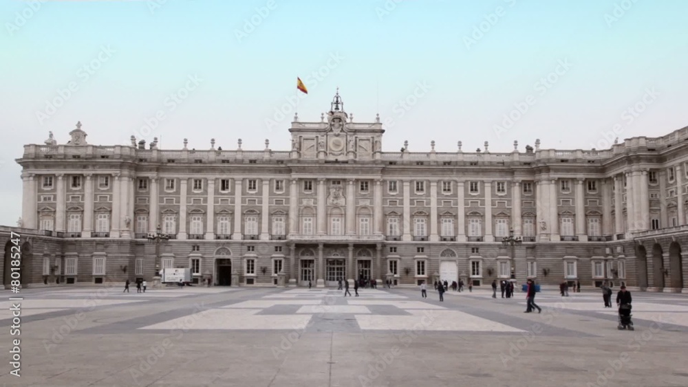 People walk by square near Palace of Spanish kings in Madrid People walk by square near Palace of Spanish kings in Madrid