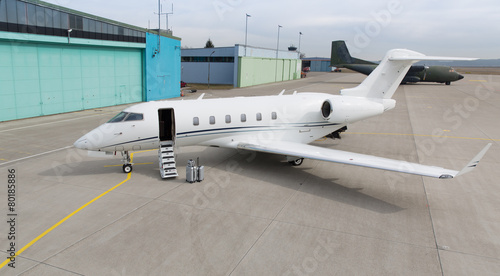 corporate private jet with luggage in front