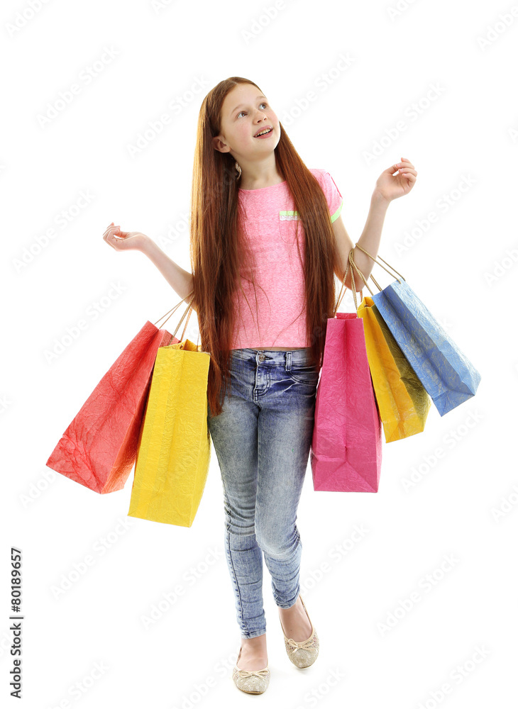 Beautiful little girl with shopping bags, isolated on white Beautiful little girl with shopping bags, isolated on white