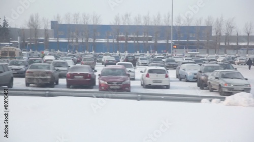 Large parking with lot of cars, trainview at winter day photo