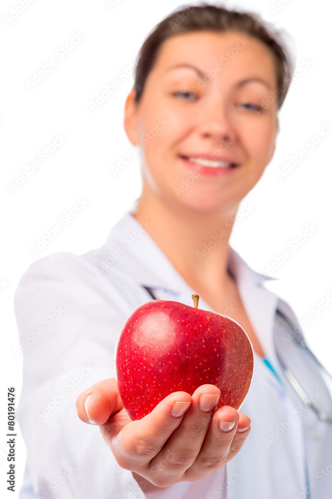 nurse stretches ripe apple for health, isolated nurse stretches ripe apple for health, isolated