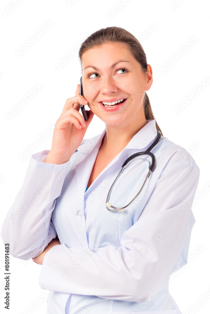 beautiful young doctor with a mobile phone isolated on white bac beautiful young doctor with a mobile phone isolated on white bac