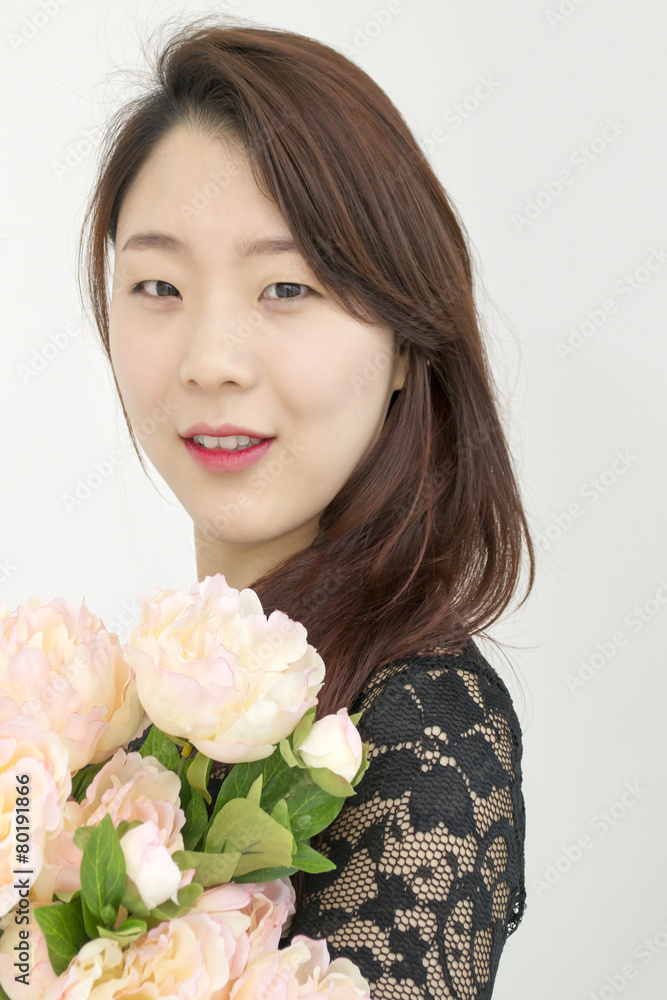Asian woman with bouquet of flowers Asian woman with bouquet of flowers