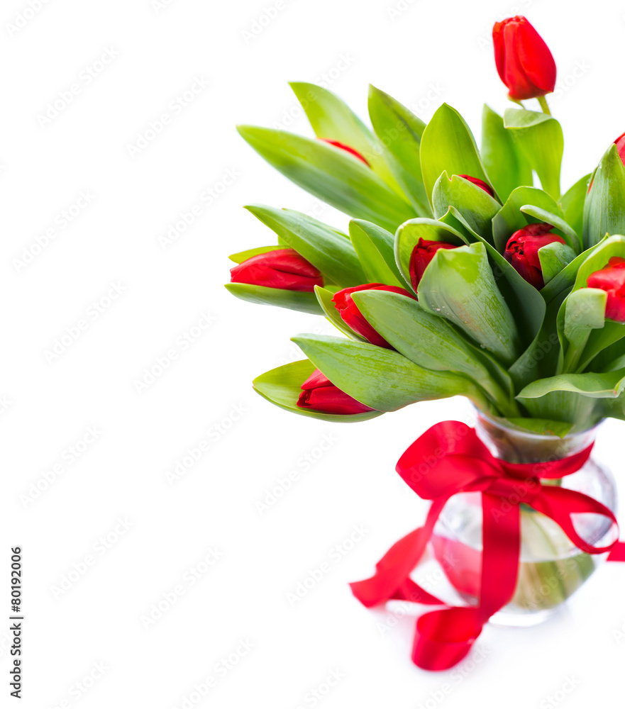 Spring tulip flowers bouquet in a vase over white Spring tulip flowers bouquet in a vase over white