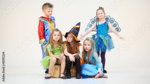 Five children in costumes isolated on white photo