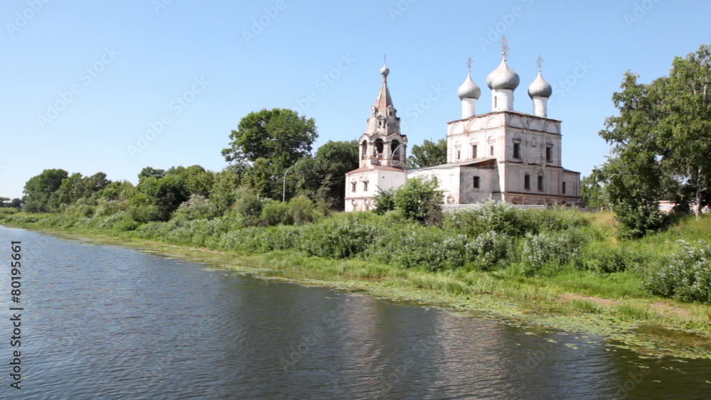Ioann Zlatousta church with silvery domes on bank of river Ioann Zlatousta church with silvery domes on bank of river