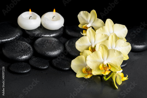 beautiful spa setting of yellow orchid phalaenopsis and candles