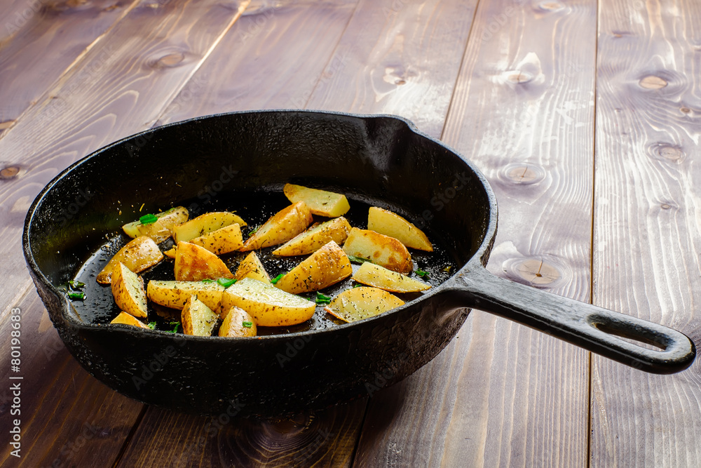 Hot fried potatoes in a pan Hot fried potatoes in a pan