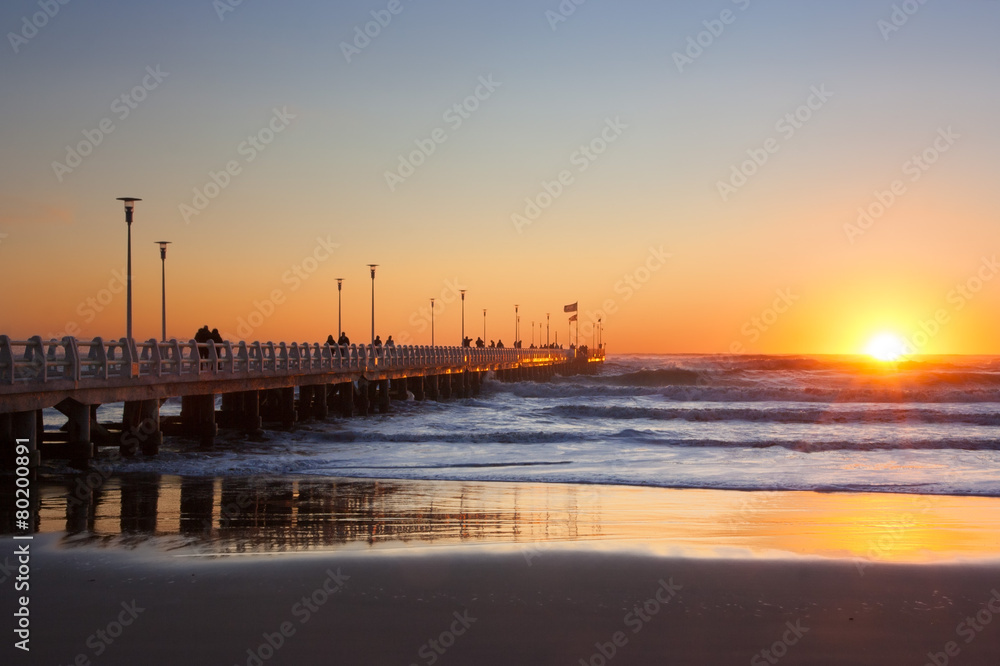 Forte dei marmi's pier with  people  admiring  sunset