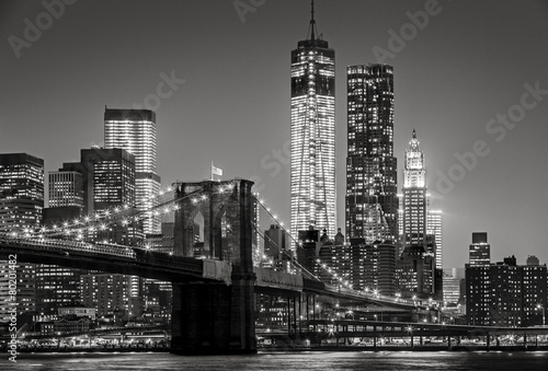 New York by night. Brooklyn Bridge, Lower Manhattan – Black an