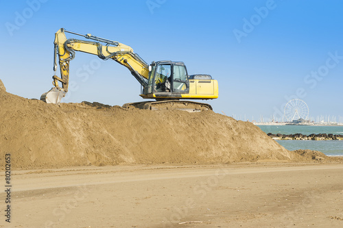 A bulldozer on the beach