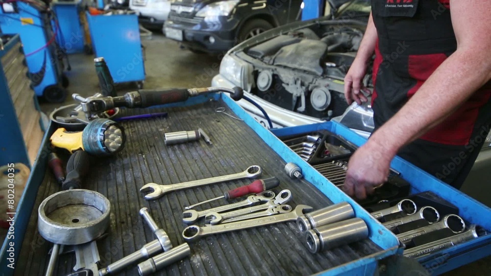 Male hands laid tools in Service station Avtostandart. Male hands laid tools in Service station Avtostandart.