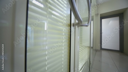 Transparent office door with doorbell and jalousie photo