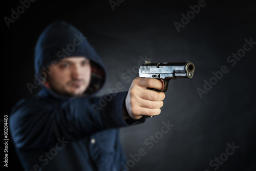 killer holding gun