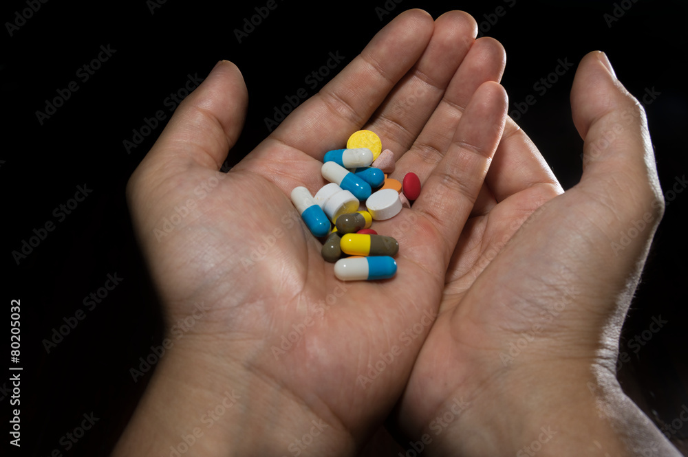 Medicine pills and capsules in hands Medicine pills and capsules in hands