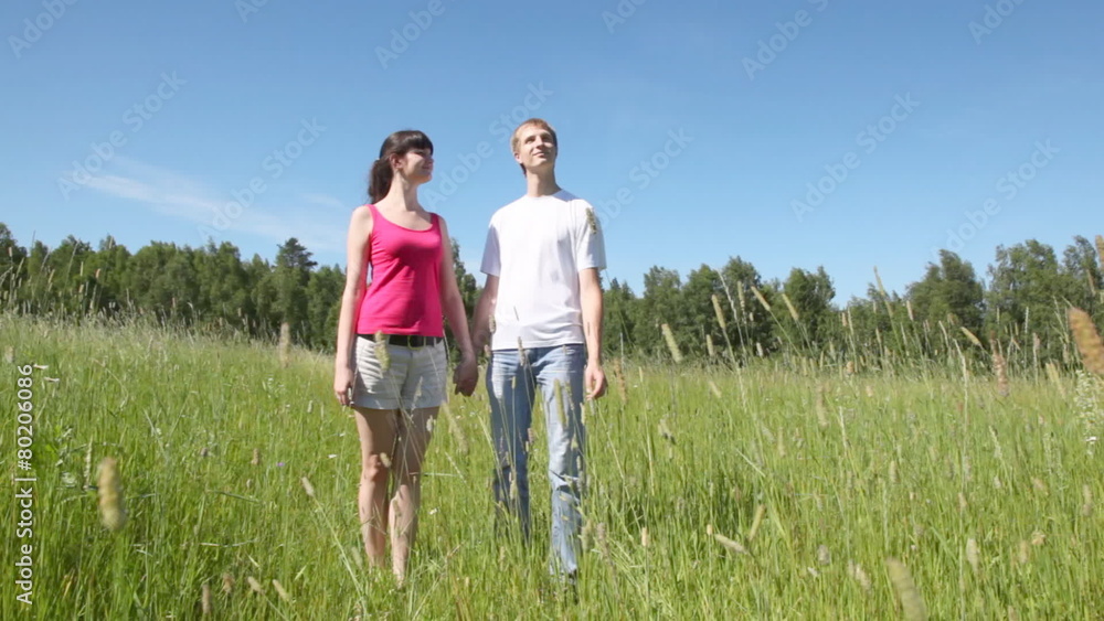 guy with girl to hold hands and smile to sun guy with girl to hold hands and smile to sun