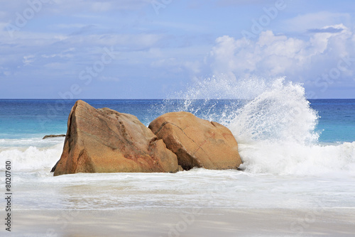 Beautiful large granite boulders in Indian Ocean on the beach of