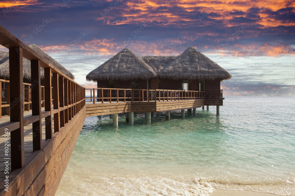 Lodges over water at the time sunset. Maldives... Lodges over water at the time sunset. Maldives...