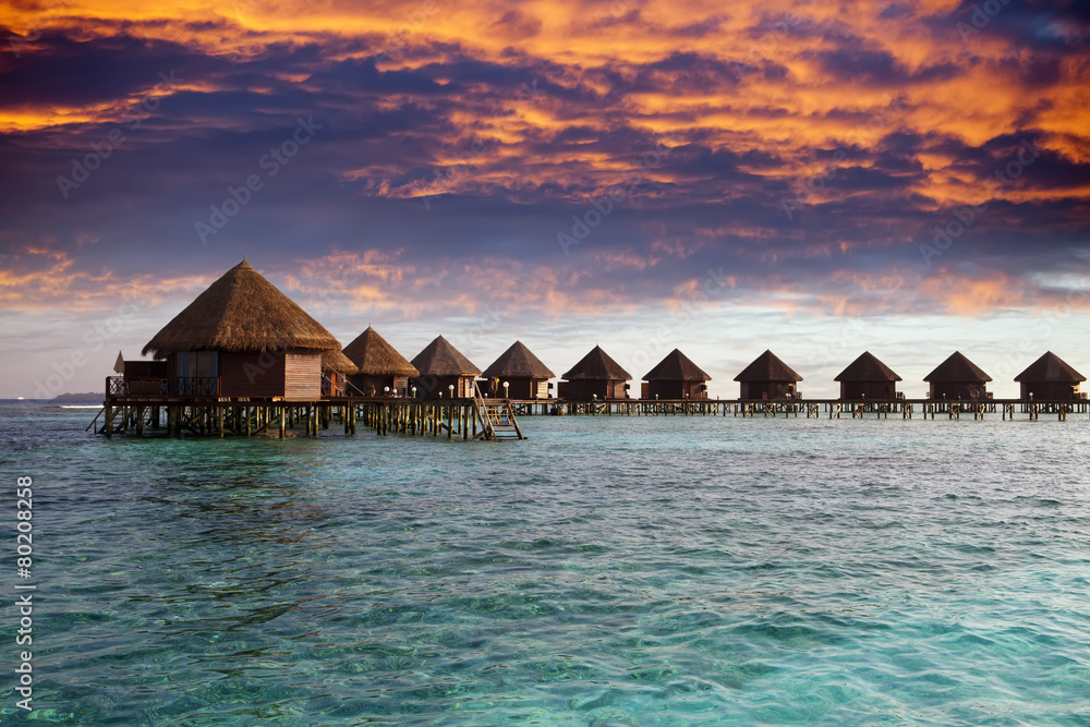 Lodges over water at the time sunset. Maldives...